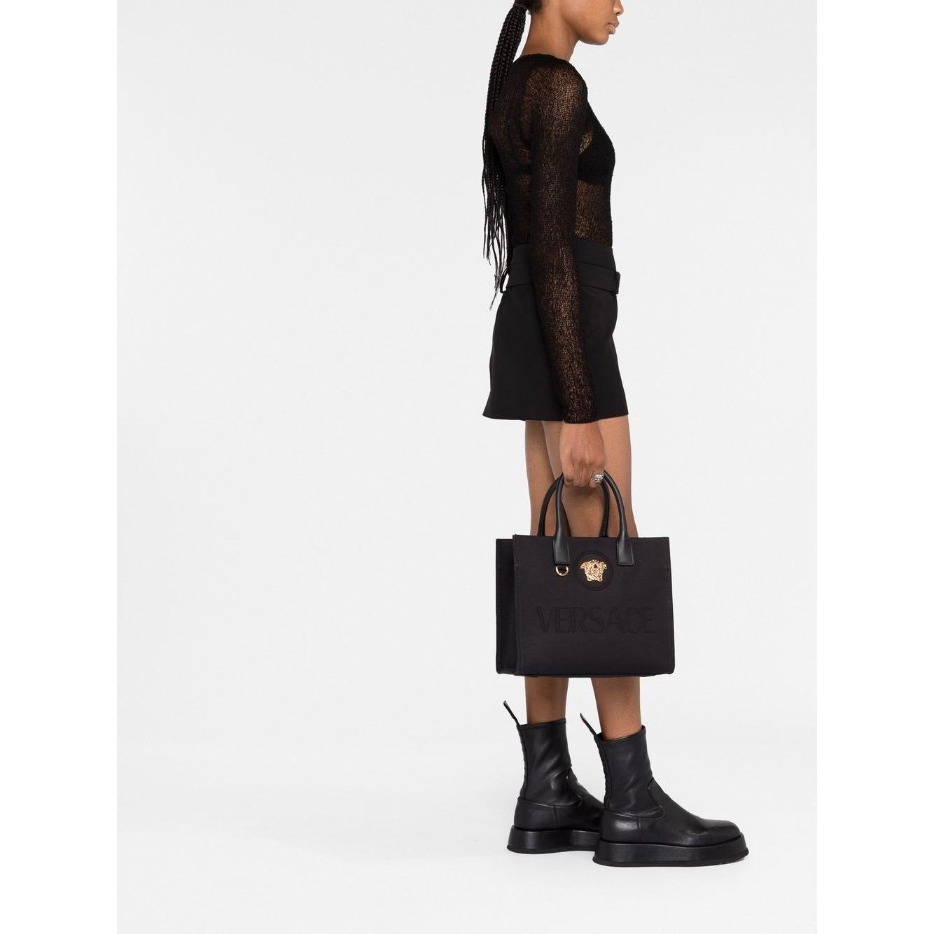 Front view with bag zipped and handles upright.