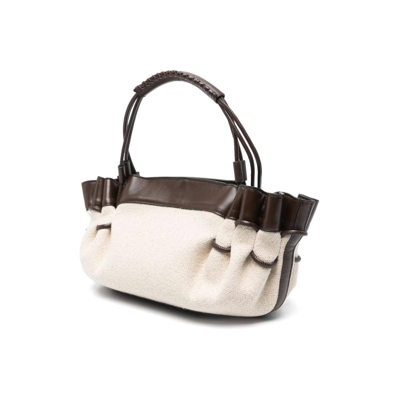 Front view with bag zipped and handles upright.