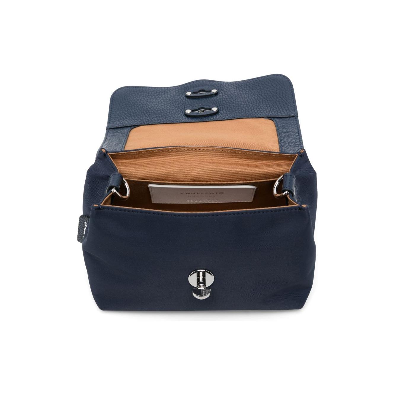 Front view with bag zipped and handles upright.