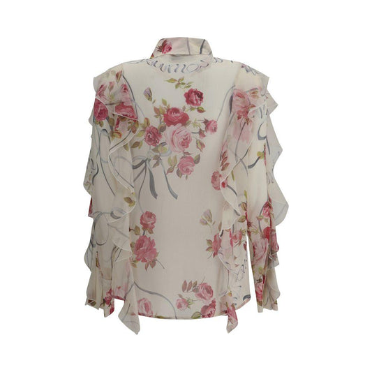 Blumarine floral silk chiffon shirt, semi-sheer with pink roses, ruffled sleeves, and elegant design.