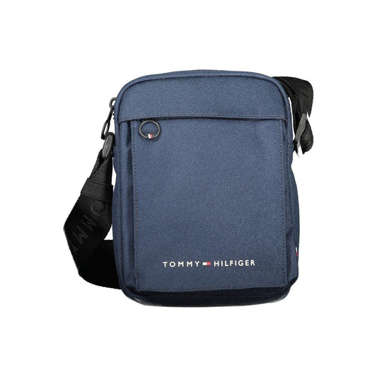 Tommy Hilfiger blue shoulder bag with adjustable strap, external and internal pockets, zip closure, and logo print on recycled polyester.