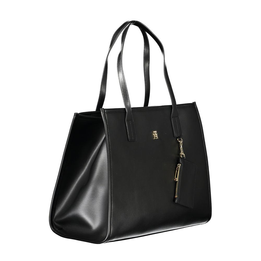 Front view with bag zipped and handles upright.