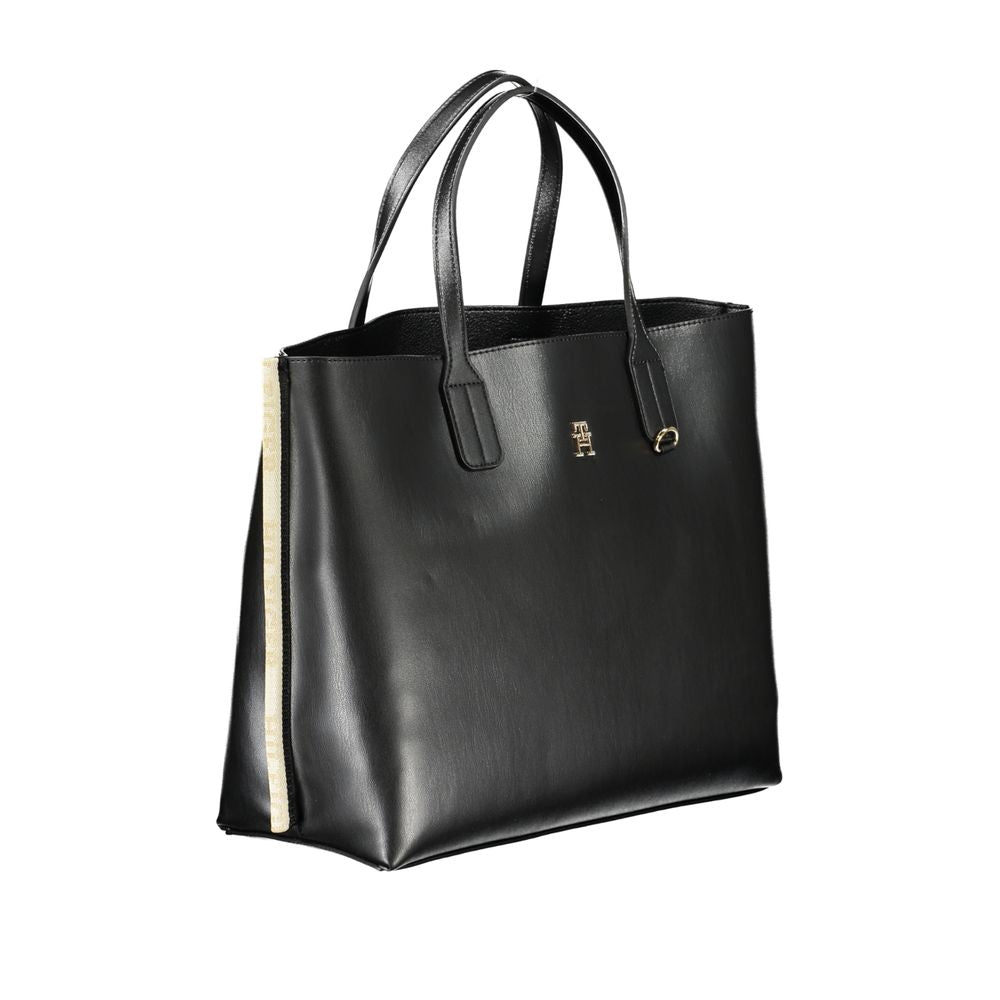 Front view with bag zipped and handles upright.