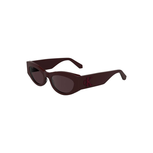 Calvin Klein red acetate women's sunglasses with cat-eye design and brown lenses, featuring a stylish CK logo for a fashion-forward look.